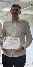 Marcus Becker showing his award